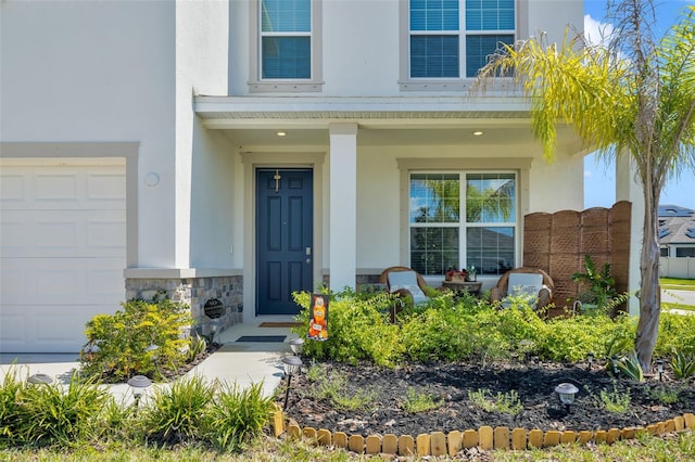 view of exterior entry featuring a porch