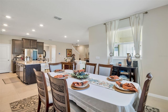 dining room featuring light tile patterned floors