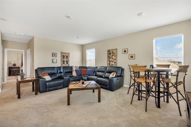 living room with light carpet and a healthy amount of sunlight