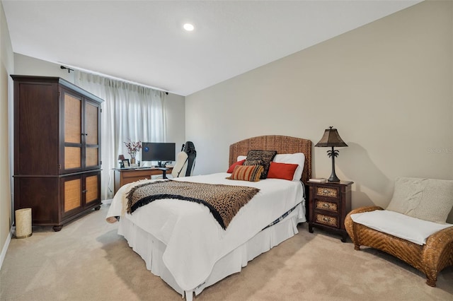 bedroom featuring light carpet and lofted ceiling