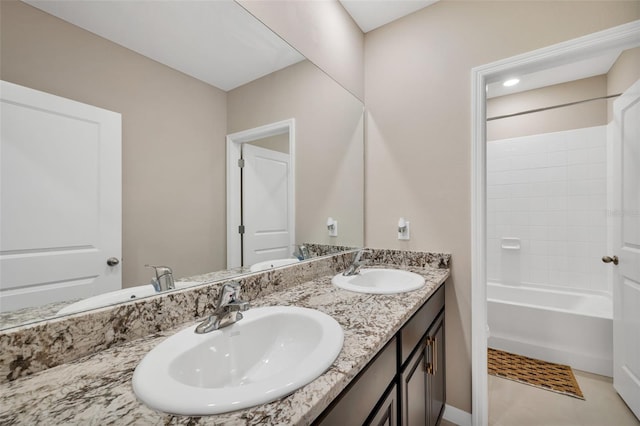 bathroom with shower / tub combination, tile patterned flooring, and vanity