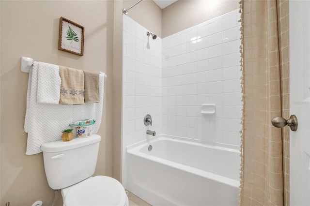 bathroom with shower / bath combo with shower curtain and toilet