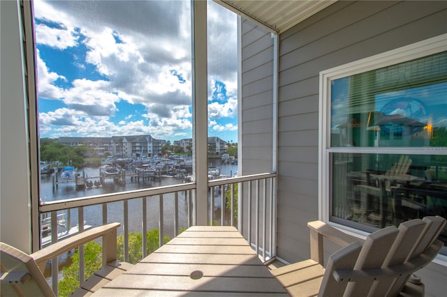 balcony featuring a water view