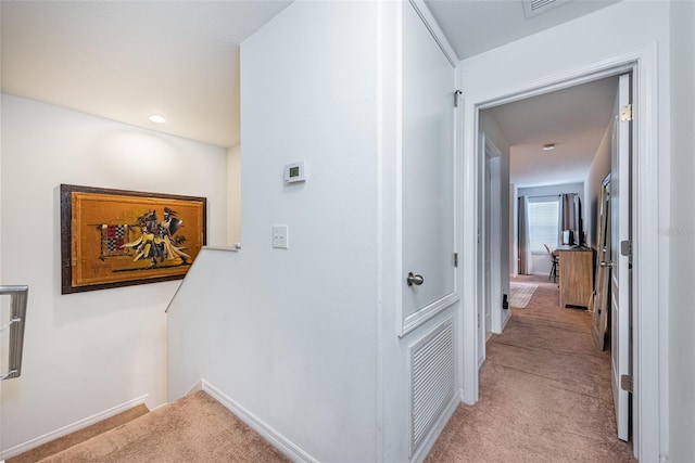 corridor with light colored carpet