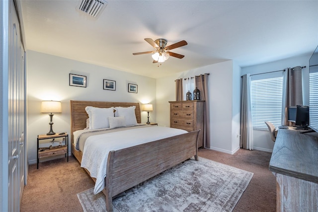 carpeted bedroom featuring a closet and ceiling fan