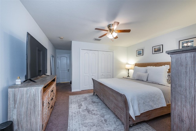 carpeted bedroom with a closet and ceiling fan