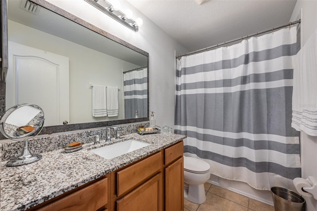 bathroom with vanity, a textured ceiling, tile patterned flooring, a shower with shower curtain, and toilet