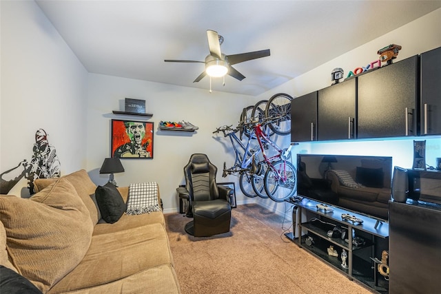 carpeted living room featuring ceiling fan