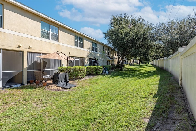 view of yard with a sunroom