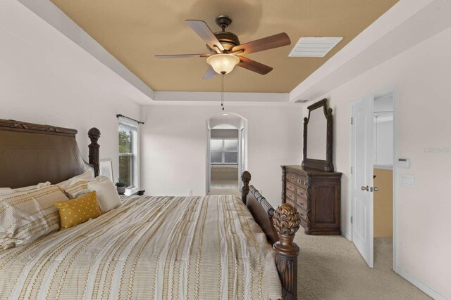 bedroom featuring ceiling fan and light colored carpet