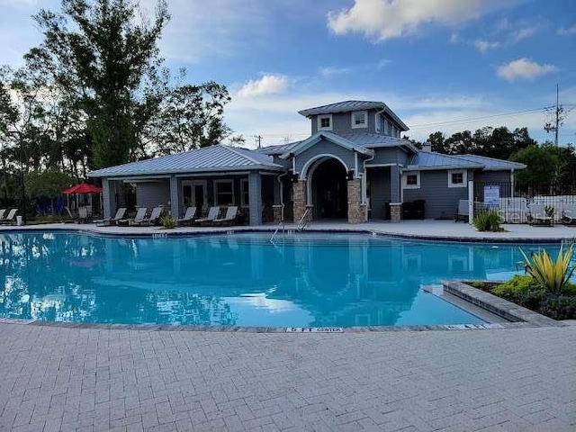 view of swimming pool featuring a patio