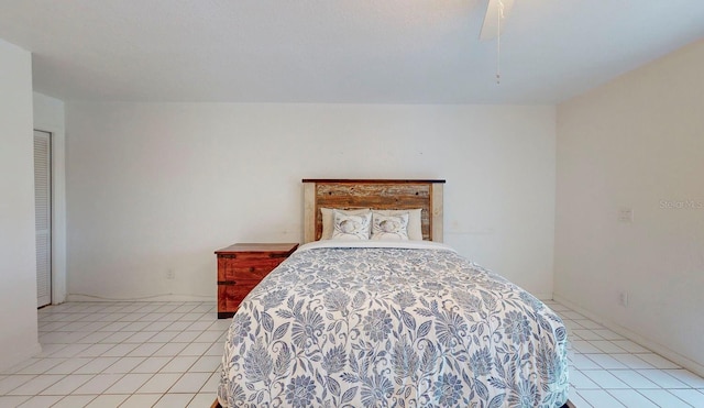 bedroom featuring ceiling fan and light tile patterned floors