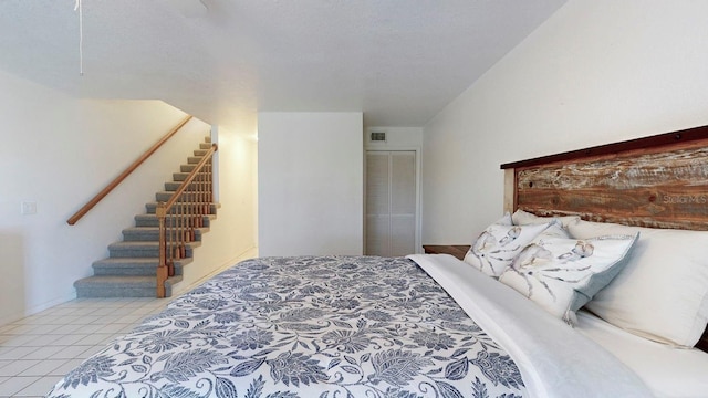 bedroom featuring light tile patterned floors