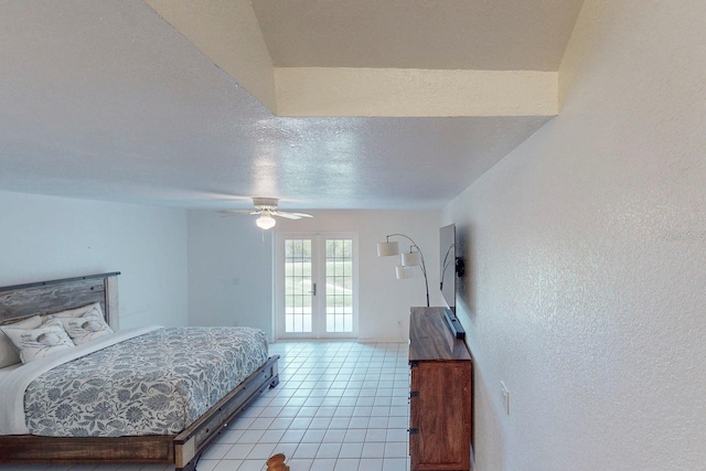 bedroom featuring ceiling fan, light tile patterned flooring, and french doors