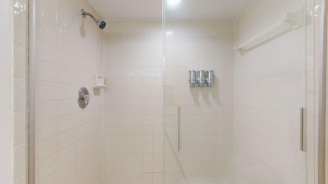 interior details with a shower with shower door