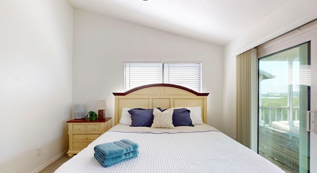 bedroom with light carpet, vaulted ceiling, and access to outside