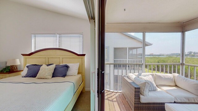 carpeted bedroom featuring vaulted ceiling