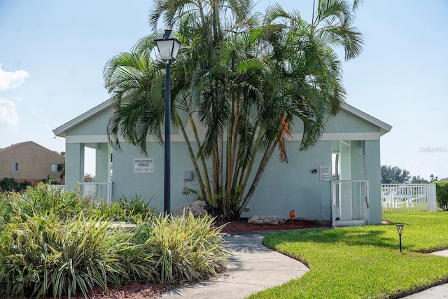 view of home's exterior featuring a lawn