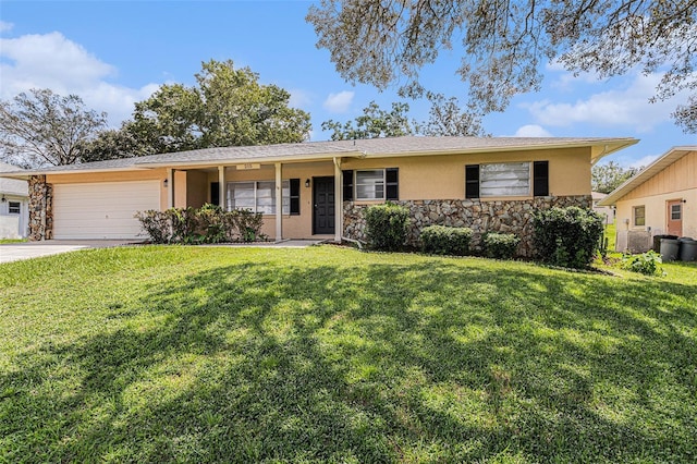 ranch-style house with a front yard and a garage