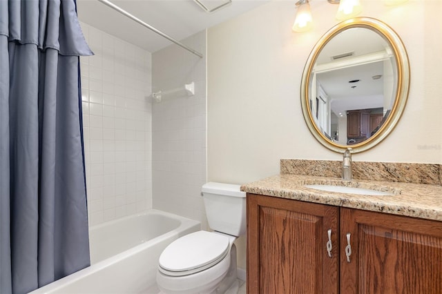 full bathroom with shower / bath combo, vanity, and toilet