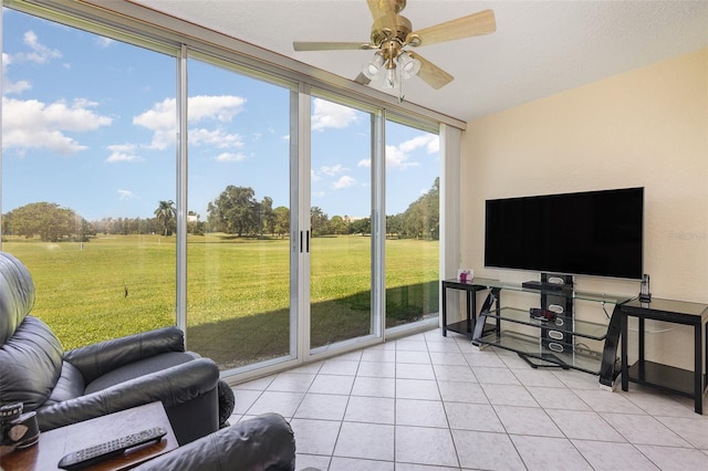 sunroom / solarium with ceiling fan and plenty of natural light