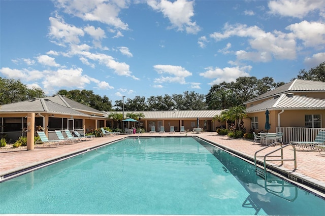 view of swimming pool with a patio area