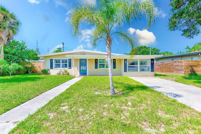 ranch-style home featuring a front yard