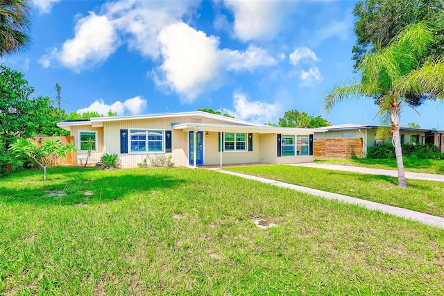 ranch-style house featuring a front lawn