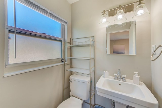 bathroom featuring sink and toilet