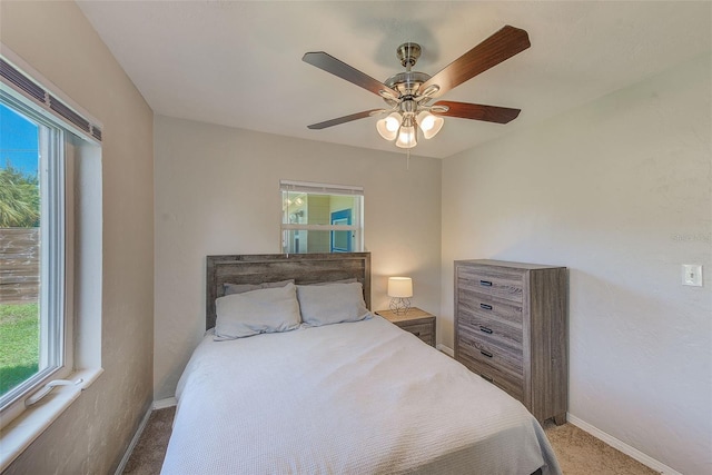 bedroom with ceiling fan and carpet flooring