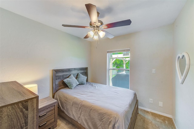 bedroom featuring ceiling fan and light colored carpet