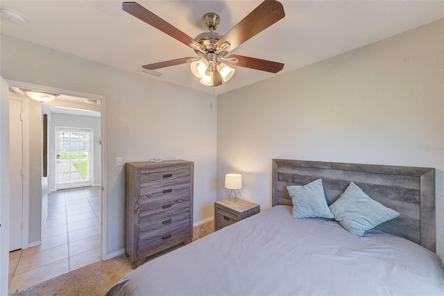 tiled bedroom with ceiling fan