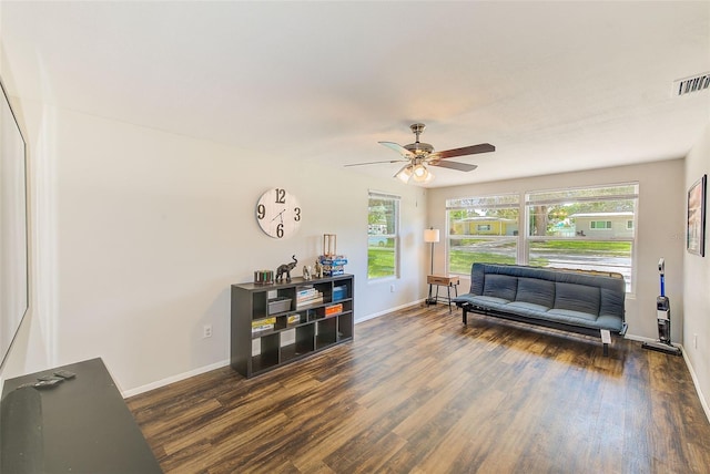 interior space featuring ceiling fan and dark hardwood / wood-style floors