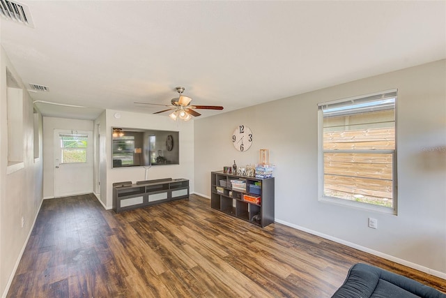 interior space featuring ceiling fan and dark hardwood / wood-style floors