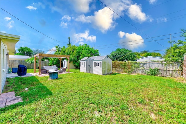 view of yard with a storage shed, a patio, and a gazebo