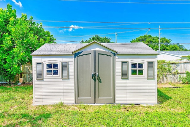 view of outdoor structure with a yard