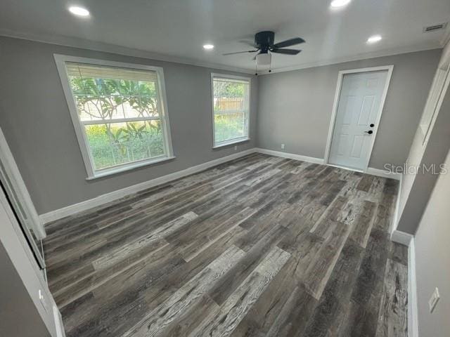 interior space featuring crown molding, dark hardwood / wood-style floors, and ceiling fan