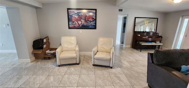 sitting room with light tile patterned floors