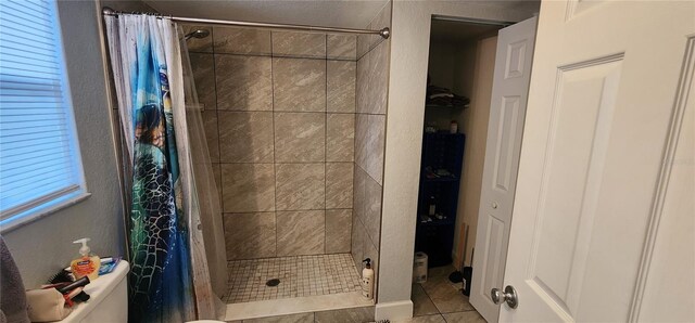 bathroom featuring tile patterned flooring and a shower with shower curtain