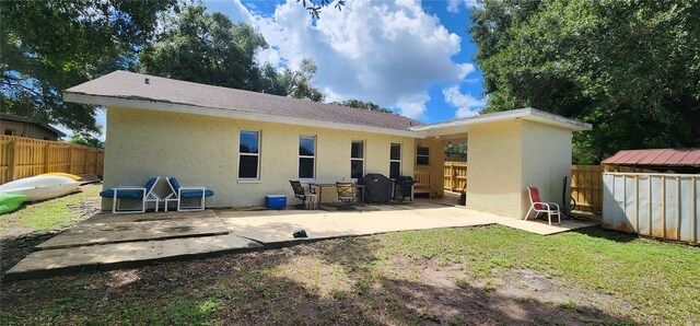 back of house with a patio area