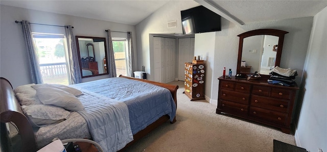 carpeted bedroom featuring vaulted ceiling