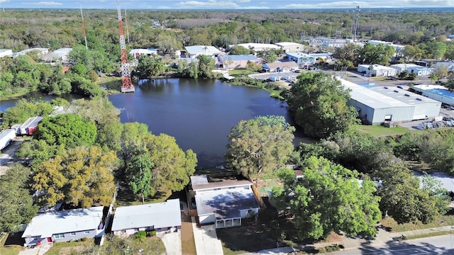 birds eye view of property featuring a view of trees and a water view