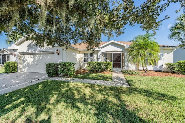 ranch-style home featuring a garage and a front yard