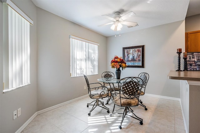 dining space featuring ceiling fan