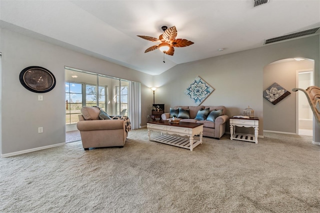 living room with lofted ceiling, light carpet, and ceiling fan