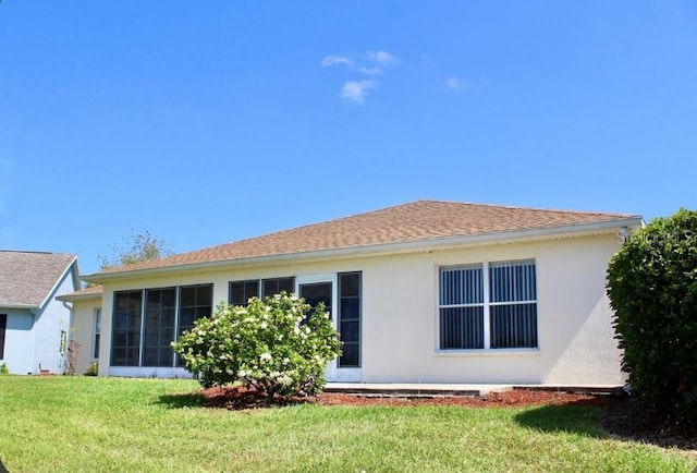 back of house with a yard