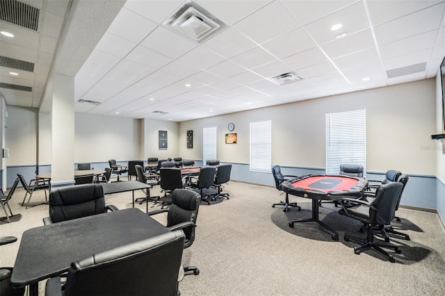 miscellaneous room featuring a drop ceiling and light carpet