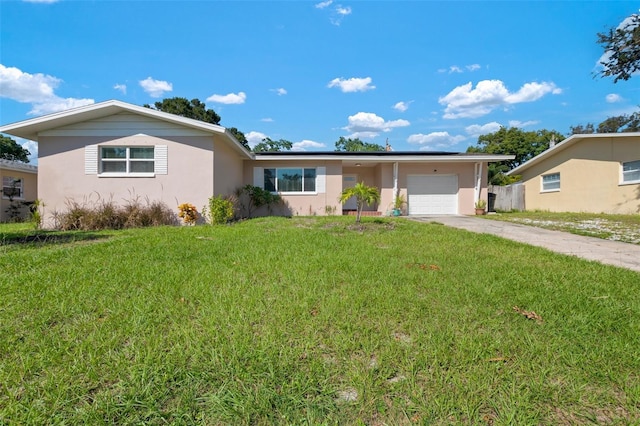 ranch-style home featuring a front lawn and a garage