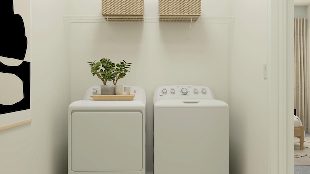 washroom with washing machine and dryer