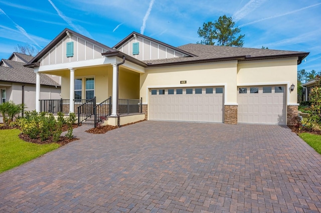 view of front facade with a garage and covered porch